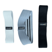 Three A90 Hip Bands with varying resistance levels displayed against a black background.