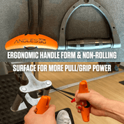 A person demonstrating the ergonomic handle and stable grip of an A90 Cable Pulley Set, possibly used for metalworking or woodworking, emphasizing the improved pull and grip power due to its Angles90 Grips.